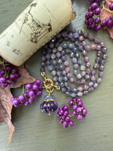 Load image into Gallery viewer, Purple and pink rubies knotted on silk and finished with a 14k gold charm clasp